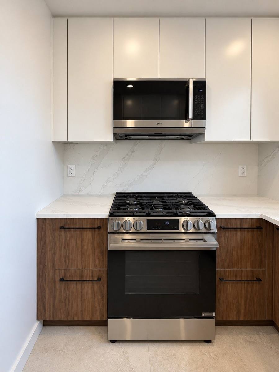 Range with full-height stone backsplash