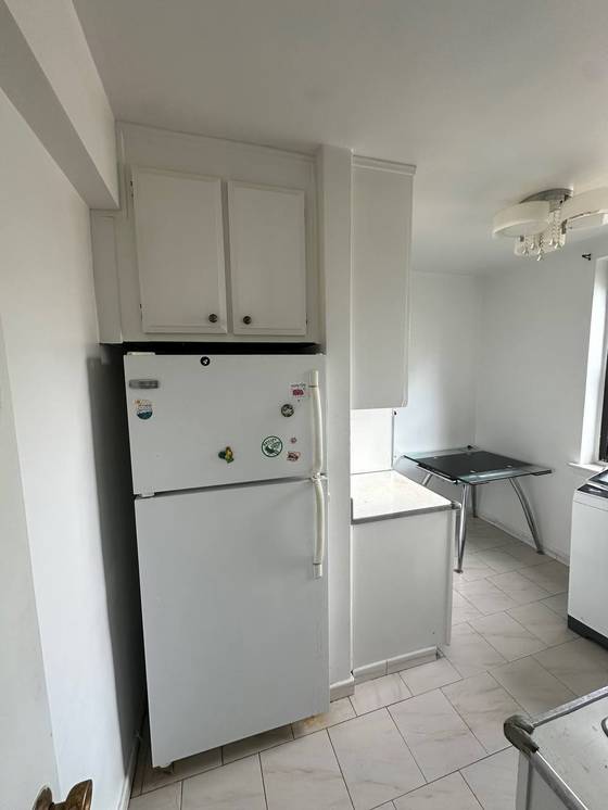 Before: Freestanding fridge and window corner