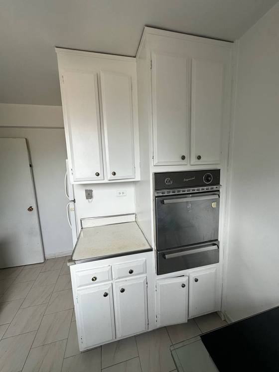 Before: Old wall oven and cabinets